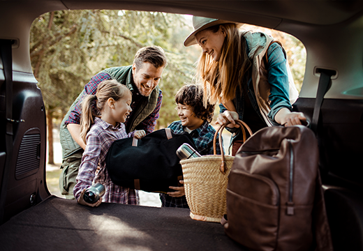 Young family packing for vacation.