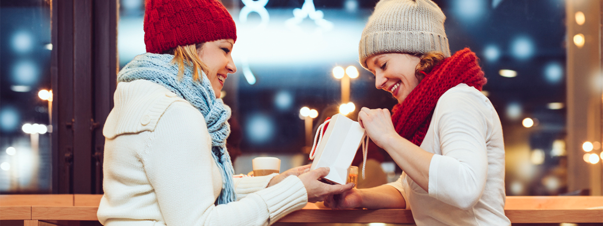 Woman gifting loved one with a CAA Membership during Holiday season.