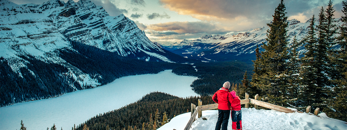 Mother and Daughter enjoying the winter views of Peyto Lake in Banff National park. Canada.