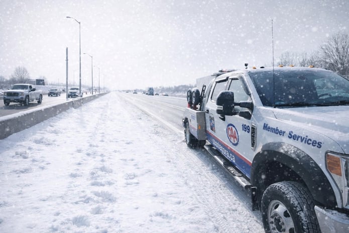 Parked CAA Truck at side of road in Snow