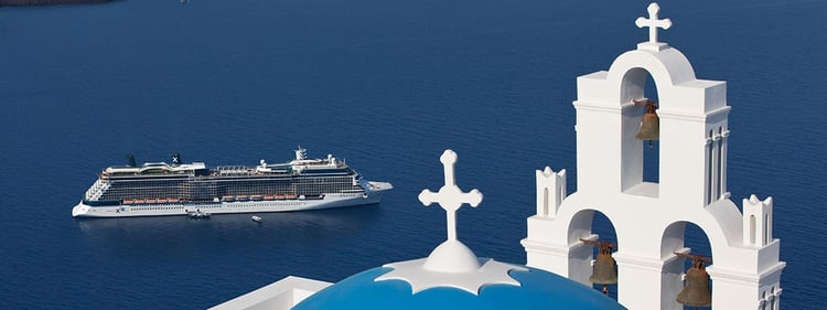 A cruise ship in approaching port in Santorini