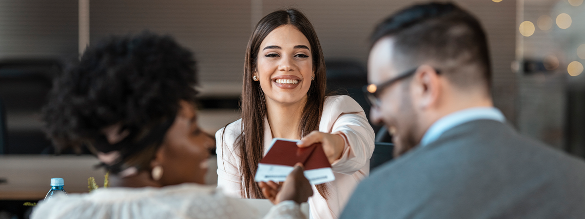 Travel agent helping a couple book travel