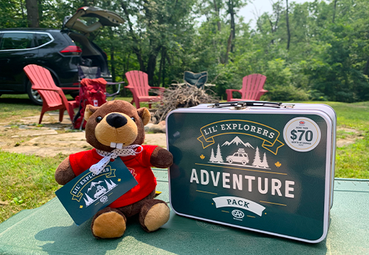Rocky the Beaver and a Lil' Explorers Adventure Pack at a campsite 