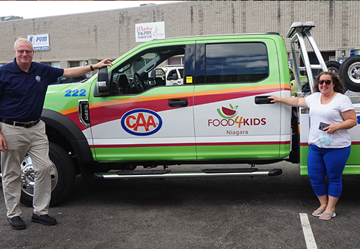 Peter Van Hezewyk, President and CEO of CAA Niagara, and Amber Hughes, Executive Director at Food4Kids Niagara, at the official truck unveiling event.
