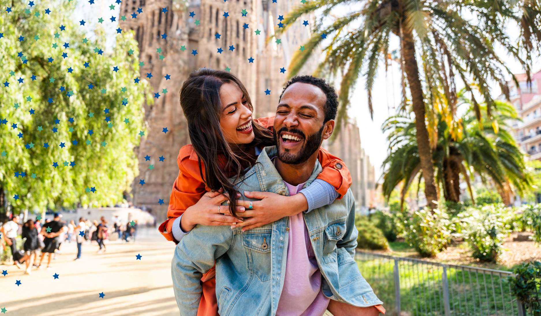 Young couple smiling on vacation together with European cathedral in the background